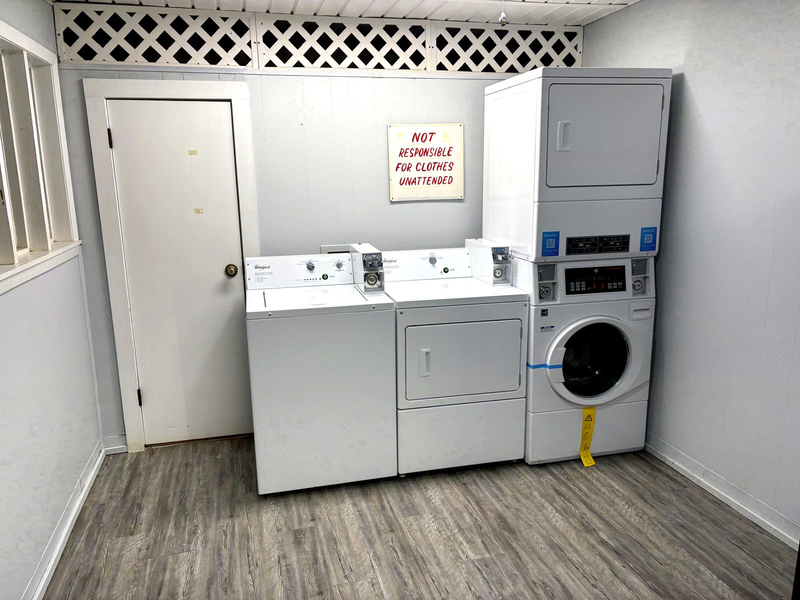 Clean laundry room with washers and dryers at Dogwood Ridge RV Park Natchitoches