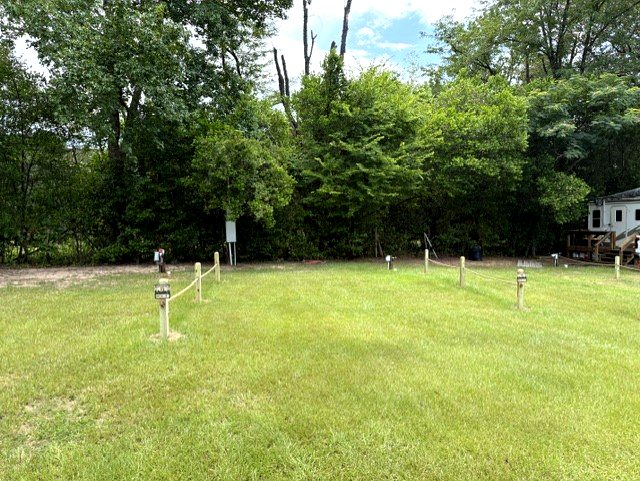 Individual site hookup posts with 30 and 50 amp service at Dogwood Ridge RV Park