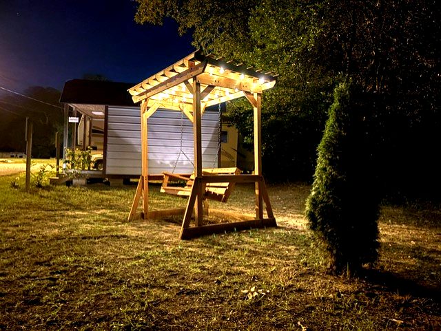 Illuminated swing set at night at Dogwood Ridge RV Park Natchitoches Louisiana